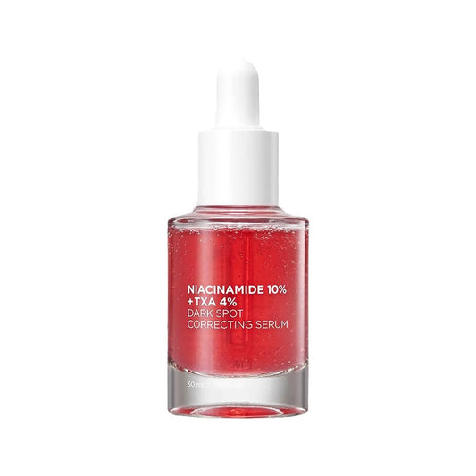 a bottle of red liquid on a white background