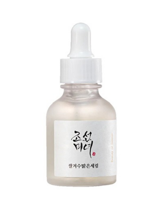 a bottle of white liquid with chinese writing on it