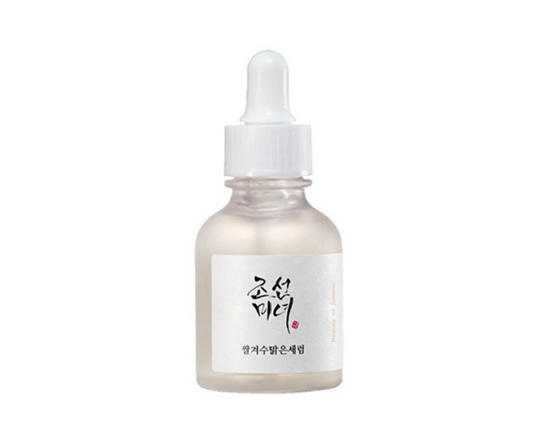 a bottle of white liquid with a white cap