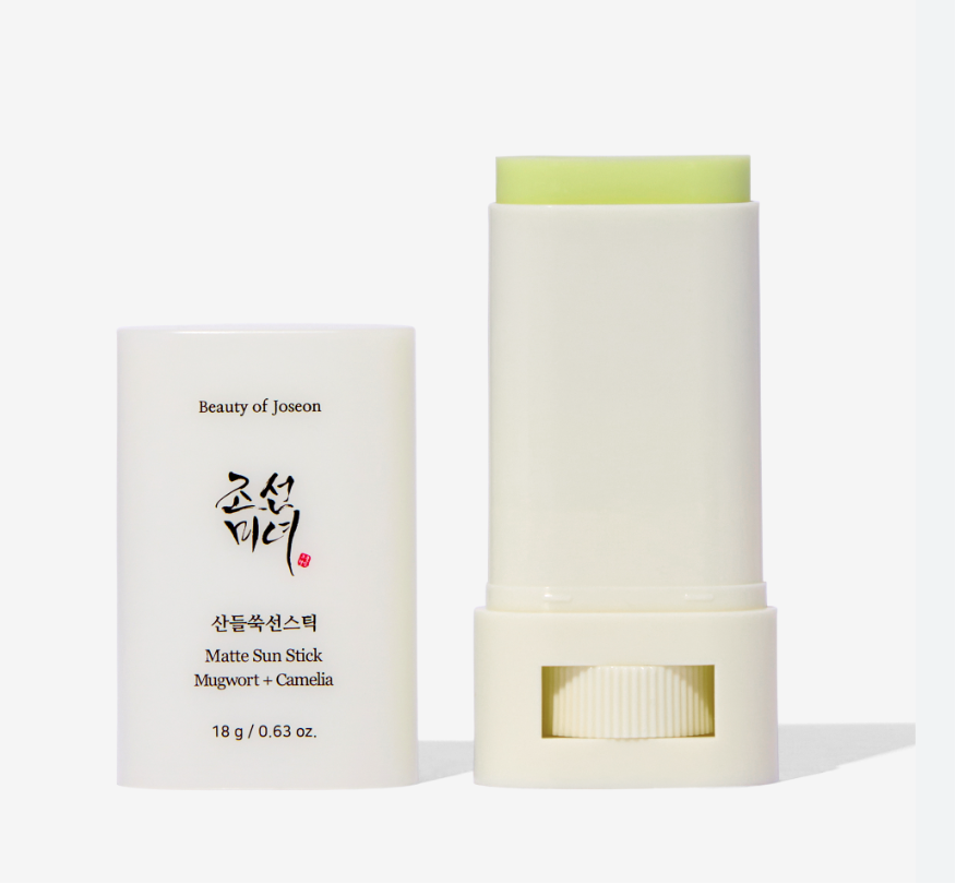 a white tube next to a white container