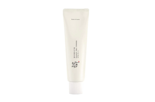 a tube of white cream on a white background