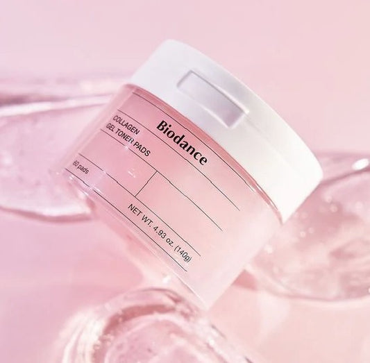 Close-up of Biodance Collagen Gel Toner Pads jar against a soft pink background, highlighting its moisturizing properties and packaging design.
