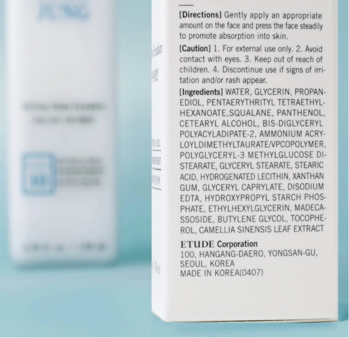 a close up of a bottle of lotion on a table