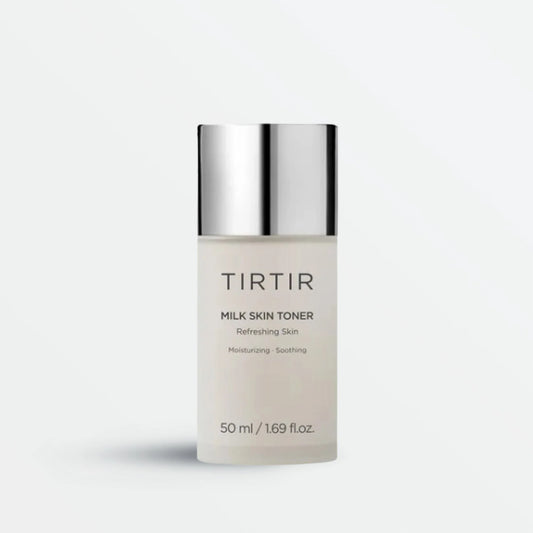 Tirtir Milk Skin Toner in a sleek frosted bottle with silver cap, showcasing its moisturizing and soothing properties for refreshing skin hydration.