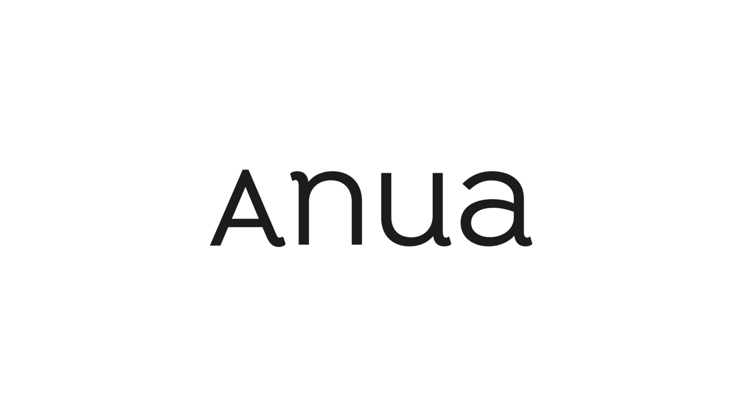 a black and white photo of the word anua