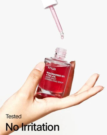 a person holding a bottle of liquid in their hand