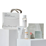 an assortment of skin care products displayed on a shelf