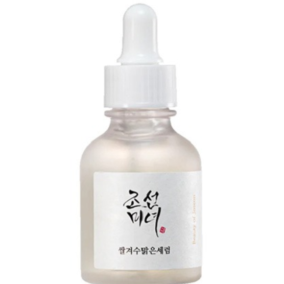 a bottle of white liquid with chinese writing on it