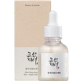 a bottle of liquid sitting next to a box