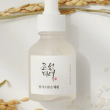 a bottle of liquid sitting on top of a table