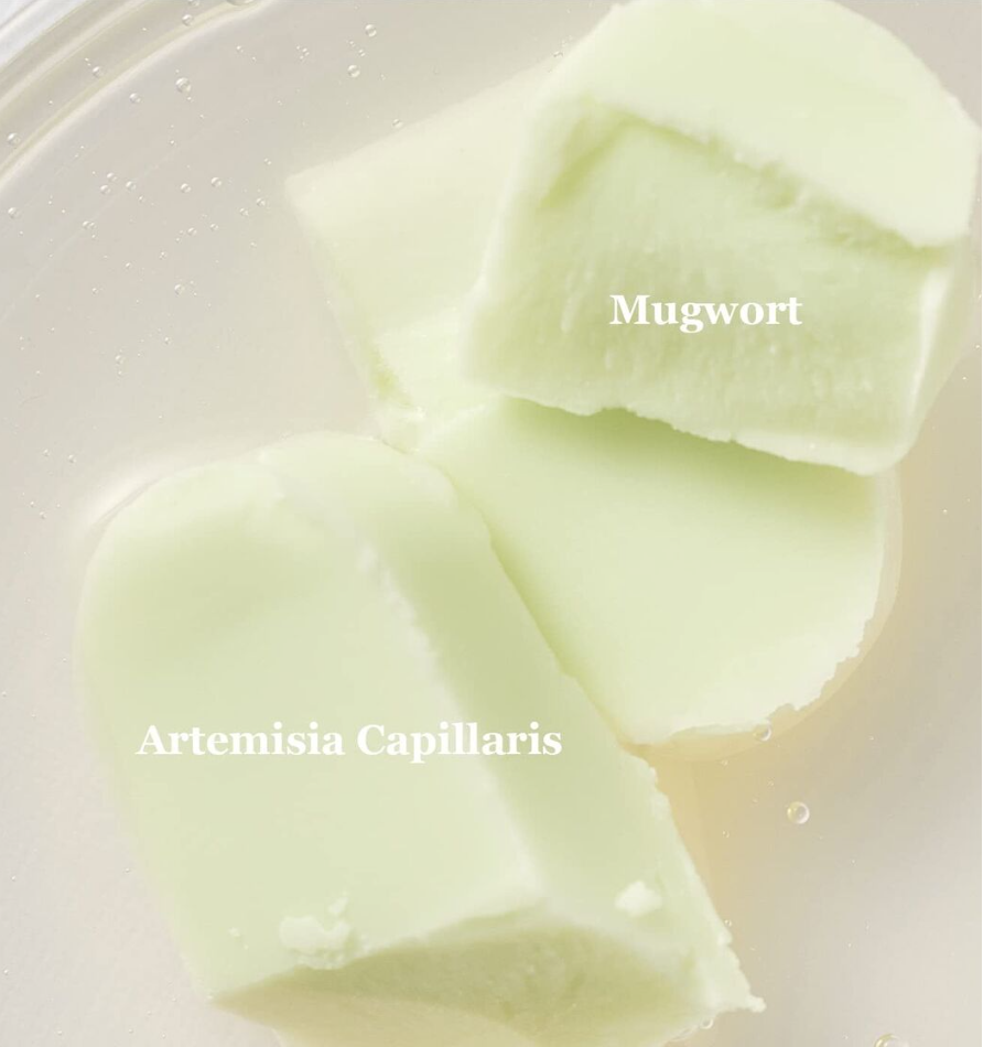 three pieces of white chocolate sitting on top of a white plate