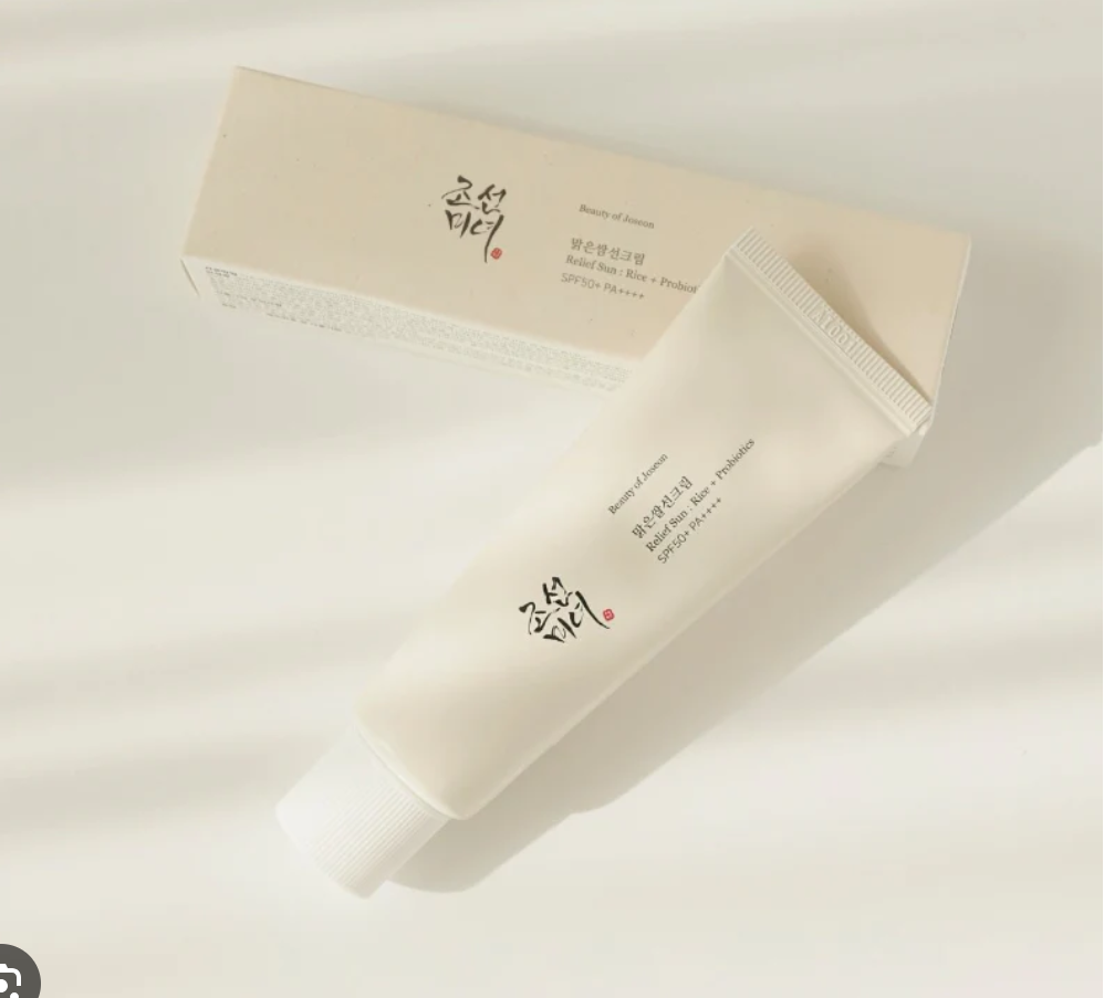 a tube of cream sitting next to a box