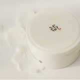 a white container with some white stuff in it