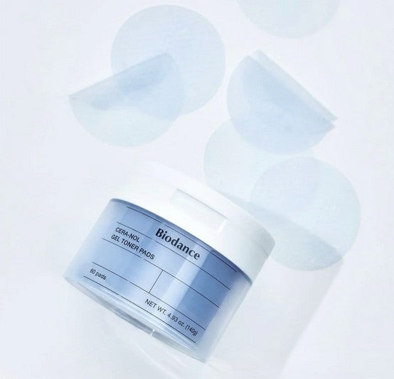 Biodance Cera-Nol Gel Toner Pads tub with several gel pads around it, emphasizing the product’s convenience and effective skin treatment.