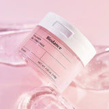 Close-up of Biodance Collagen Gel Toner Pads jar against a soft pink background, highlighting its moisturizing properties and packaging design.