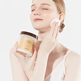 Model using Skinfood Carrot Carotene Calming Water Pad on her face, highlighting hydration and soothing benefits for sensitive skin.
