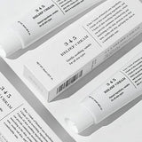 Stylized arrangement of Dr. Althea 345 Relief Cream tubes with their packaging, demonstrating the product's clean, minimalist aesthetic.