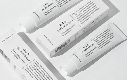 Stylized arrangement of Dr. Althea 345 Relief Cream tubes with their packaging, demonstrating the product's clean, minimalist aesthetic.