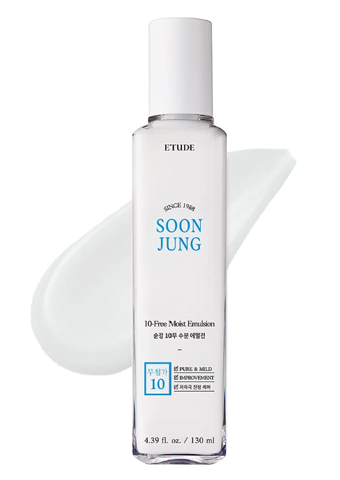 a bottle of liquid sitting on top of a white surface