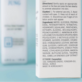 a close up of a bottle of lotion on a table