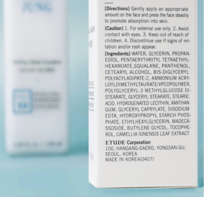 a close up of a bottle of lotion on a table