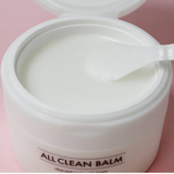 a white container with a spoon inside of it