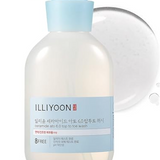 a bottle of liquid sitting on top of a white surface