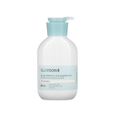 a bottle of liquid sitting on top of a white surface