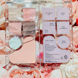 The rom&nd Bare Layer Mood Palette featuring the Strawberry Mood collection, opened to reveal its delightful shades and names on a floral background.