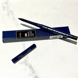 a couple of pencils sitting on top of a table