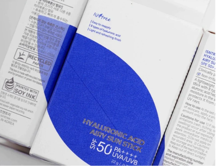 three packages of toothpaste sitting on top of each other