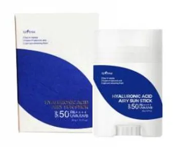 a box of sunscreen and a stick of sunscreen on a white background