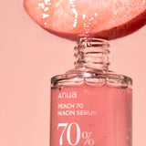 a bottle of nail polish with an apple on top of it