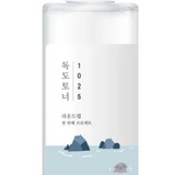 Round Lab 1025 Dokdo Toner in a clear bottle showcasing a modern, simplistic label with ocean elements, emphasizing its nourishing and hydrating properties.