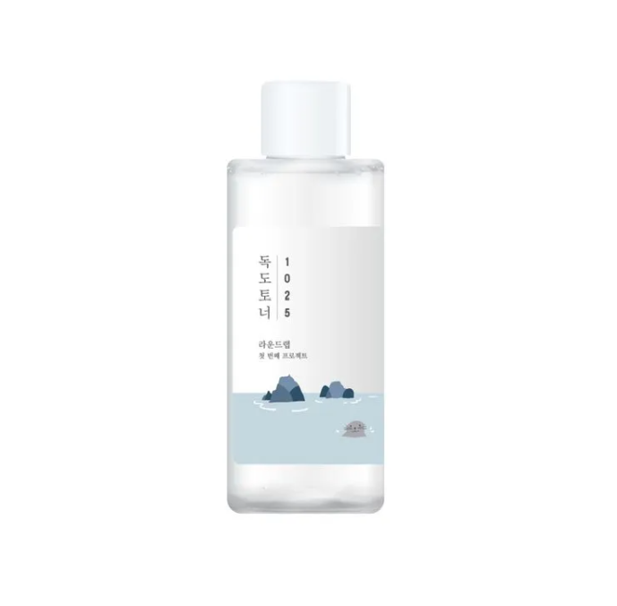 Round Lab 1025 Dokdo Toner bottle featuring a minimalistic design with blue tones and mountain imagery, embodying a hydrating exfoliator with deep sea water.