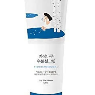 Close-up of Round Lab Birch Juice Moisturizing Sun Cream SPF 50+ showcasing its elegant packaging featuring a woman and birch tree motif.