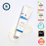 Round Lab Birch Juice Moisturizing Sun Cream SPF 50+ displayed on a flat surface with awards, emphasizing its recognition for quality skin care.