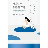 Close-up view of Round Lab Birch Juice Moisturizing Sun Stick, showcasing its artistic design with a girl relaxing near a birch tree, emphasizing its SPF 50+ PA++++ UV protection benefits.