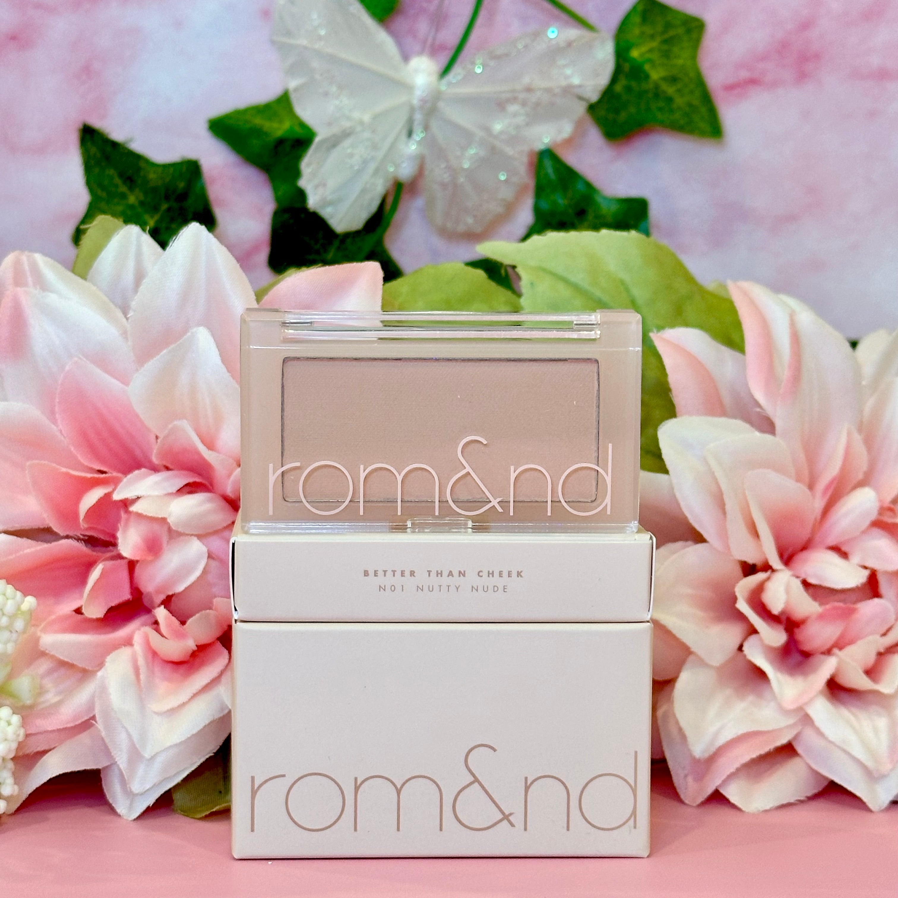 Rom&nd Better Than Cheek blush in N01 Nutty Nude, elegantly presented with floral accents, perfect for adding a subtle touch of color to your makeup routine.