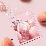 a book with a bottle of nail polish next to some peaches