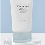Skin1004 Madagascar Centella Water-Fit Sun Serum displayed elegantly against a pastel blue background, accentuating its premium formulation rich in Centella Asiatica.