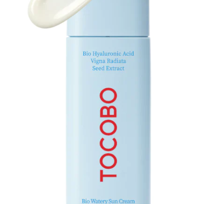Tocobo Bio Watery Sun Cream with a small amount of cream squeezed out, illustrating its moisturizing texture without leaving a white cast.