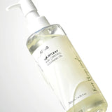 a bottle of liquid sitting on top of a table