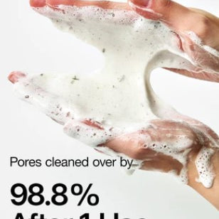 a pair of hands holding a white substance