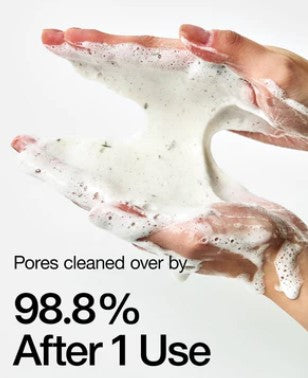 a pair of hands holding a white substance