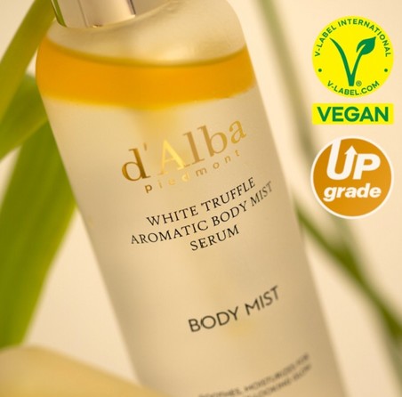 User applying d'Alba White Truffle Aromatic Body Mist Serum, emphasizing its lightweight feel and nourishing benefits as a hydrating body serum.