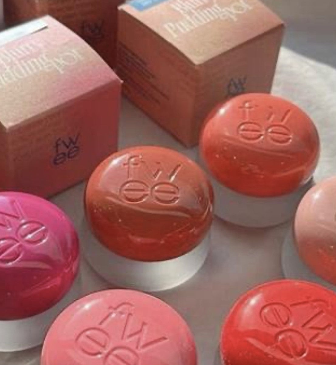 a table topped with different types of lipstick