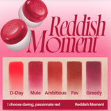 the redish moment lipstick is shown on a pink background