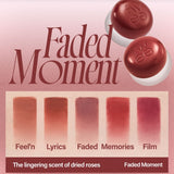 a close up of a lipstick on a pink background