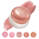 a close up of a pink powder on a white background